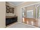 Charming wet bar with granite countertop, dark cabinetry, and stylish decor at 1437 Chelton Oaks Pl, Raleigh, NC 27614