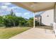 Relaxing covered back patio with a ceiling fan, perfect for enjoying the serene outdoor views at 1522 Palmer Hill Dr, Durham, NC 27703