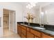 Bathroom with double sinks, granite countertop, and updated fixtures at 1522 Palmer Hill Dr, Durham, NC 27703