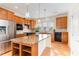Modern kitchen with stainless steel appliances, granite countertops, and an island with bar seating at 1522 Palmer Hill Dr, Durham, NC 27703