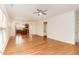 Bright living room featuring hardwood floors, a ceiling fan, and an open layout, ideal for modern living at 1522 Palmer Hill Dr, Durham, NC 27703