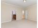 Open main bedroom with neutral carpet and access to an ensuite bathroom and another bedroom at 1522 Palmer Hill Dr, Durham, NC 27703
