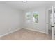 Bright bedroom with neutral walls, plush carpet, and abundant natural light from the double window at 163 Davelyn Ct, Garner, NC 27529
