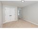 Neutral bedroom features double doors and offers access to other areas of the home, making it a flexible space at 163 Davelyn Ct, Garner, NC 27529