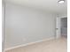 Minimalist bedroom with carpet, one window and a door, offers access to other areas of the home at 163 Davelyn Ct, Garner, NC 27529