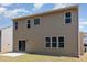 The back exterior showcases neutral siding, a patio, and multiple windows for bright, natural light at 163 Davelyn Ct, Garner, NC 27529