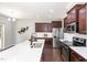 Modern kitchen featuring stainless steel appliances, center island, and ample storage at 163 Davelyn Ct, Garner, NC 27529
