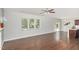 Open-concept living room with fireplace, hardwood floors, and lots of natural light at 163 Davelyn Ct, Garner, NC 27529