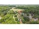 An aerial view of a charming house bordered by green trees and a quiet, pleasant neighborhood at 1647 Turner Rd, Mebane, NC 27302