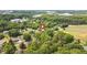 Aerial view of the property's location in a green, tree-filled neighborhood at 1647 Turner Rd, Mebane, NC 27302