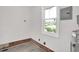 Unfinished basement space with a window, bare floors and visible utilities at 1647 Turner Rd, Mebane, NC 27302