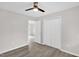 Bedroom with light gray walls, vinyl floors, closet and doorway at 1647 Turner Rd, Mebane, NC 27302