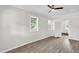 Spacious bedroom with natural light and wood-look floors at 1647 Turner Rd, Mebane, NC 27302