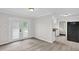 Bright dining area with modern flooring and glass doors to the exterior at 1647 Turner Rd, Mebane, NC 27302