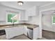 Charming kitchen with white cabinets, granite counters, and stainless dishwasher at 1647 Turner Rd, Mebane, NC 27302