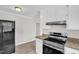 Modern kitchen featuring stainless appliances, granite countertops, and white cabinetry at 1647 Turner Rd, Mebane, NC 27302
