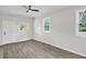 Bright living room featuring updated flooring, neutral paint, and natural light from multiple windows at 1647 Turner Rd, Mebane, NC 27302