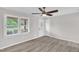 Bright living room featuring modern ceiling fan and vinyl flooring at 1647 Turner Rd, Mebane, NC 27302