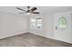 Bright living room featuring modern ceiling fan and vinyl flooring at 1647 Turner Rd, Mebane, NC 27302