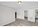Bright living room with gray walls, white trim, and wood-look floors at 1647 Turner Rd, Mebane, NC 27302