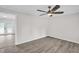 Bright living room featuring modern ceiling fan and vinyl flooring at 1647 Turner Rd, Mebane, NC 27302