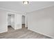 Bright living room with gray walls, white trim, and wood-look floors at 1647 Turner Rd, Mebane, NC 27302