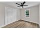 Clean bedroom with wood-look floors, closet, and a ceiling fan at 1732 Green Pace Rd, Zebulon, NC 27597