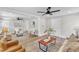 Bright living room featuring modern decor, ceiling fan, and neutral color palette at 1732 Green Pace Rd, Zebulon, NC 27597