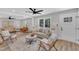 Bright living room with hardwood floors, stylish furniture, a large window, and ceiling fan at 1732 Green Pace Rd, Zebulon, NC 27597