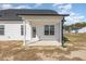 Covered back patio with view of backyard at 175 Trescott St, Smithfield, NC 27577