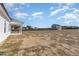 Expansive backyard with view of neighboring homes under a bright blue sky at 175 Trescott St, Smithfield, NC 27577
