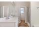 A bathroom is equipped with double sinks, a shower stall, and stylish fixtures at 175 Trescott St, Smithfield, NC 27577