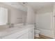 Bright bathroom featuring a double vanity, large mirror, and tub with shower at 175 Trescott St, Smithfield, NC 27577