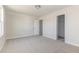 Cozy bedroom with neutral carpet and an open door to a walk-in closet at 175 Trescott St, Smithfield, NC 27577
