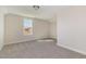 Carpeted bedroom with a large window offering an exterior view at 175 Trescott St, Smithfield, NC 27577