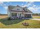 Attractive home with a gray garage door, stone accents, and a freshly seeded front yard at 175 Trescott St, Smithfield, NC 27577