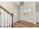 Bright foyer with beautiful front door, hardwood floors, and staircase at 175 Trescott St, Smithfield, NC 27577