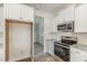 A kitchen is equipped with granite counters, stainless appliances, and ample cabinet space at 175 Trescott St, Smithfield, NC 27577