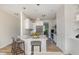 A kitchen features granite counters, stainless appliances, and a center island with seating at 175 Trescott St, Smithfield, NC 27577