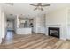 Open-concept living room and kitchen with beautiful hardwood floors at 175 Trescott St, Smithfield, NC 27577