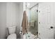 Modern bathroom featuring a tiled walk-in shower, updated fixtures and a toilet at 1806 Carrington Dr, Raleigh, NC 27615