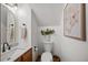 Charming powder room with stylish decor, modern fixtures, and ample lighting at 1806 Carrington Dr, Raleigh, NC 27615