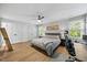 Bright bedroom with a ceiling fan, natural light and dual closets at 1806 Carrington Dr, Raleigh, NC 27615