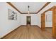 Inviting living room with natural light, wood trim, and views through an open doorway at 1806 Carrington Dr, Raleigh, NC 27615