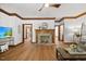 Bright living room featuring a brick fireplace, stylish furniture, and decor at 1806 Carrington Dr, Raleigh, NC 27615