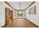 Bright, spacious living room boasting large windows and stylish wood trim and flooring at 1806 Carrington Dr, Raleigh, NC 27615