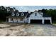 Exterior of a new home build with two-car garage and black roof at 196 Cozy Brook Ct, Clayton, NC 27520