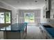 A view of a bright and modern kitchen under construction with white cabinets and an eat in island at 196 Cozy Brook Ct, Clayton, NC 27520