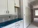 Kitchenette featuring white cabinets and drawers at 196 Cozy Brook Ct, Clayton, NC 27520