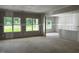 Spacious living room featuring multiple windows bringing natural light and unfinished walls at 196 Cozy Brook Ct, Clayton, NC 27520